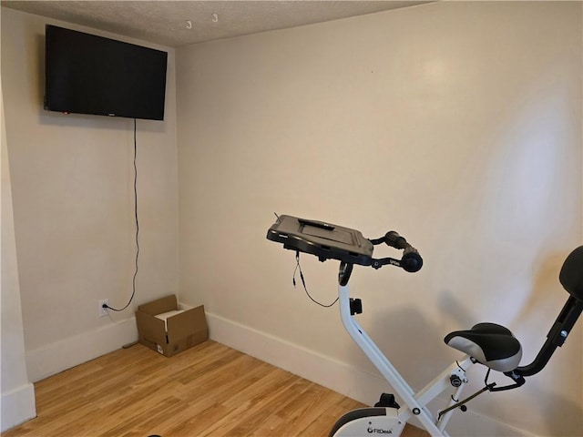 211 Steko Ave, Rochester, NY 14615 - workout area with light wood-type flooring and a textured ceiling
