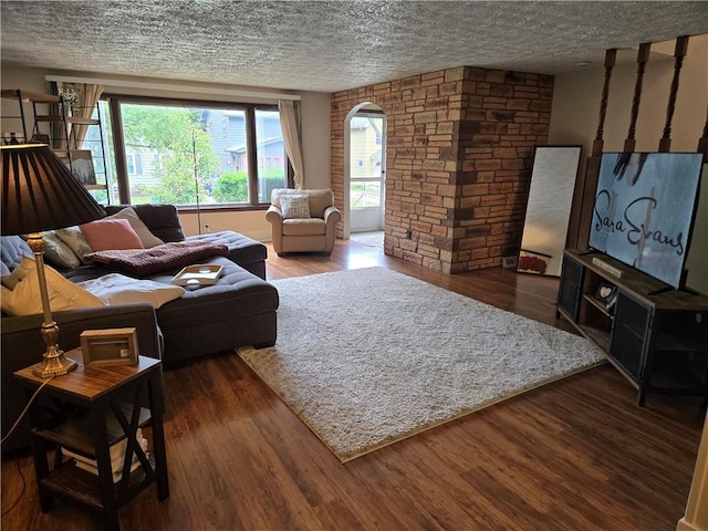 211 Steko Ave, Rochester, NY 14615 - living area featuring wood finished floors, a textured ceiling, and arched walkways