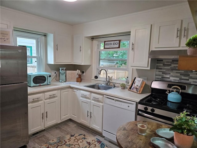 211 Steko Ave, Rochester, NY 14615 - kitchen featuring stainless steel appliances, healthy amount of natural light, white cabinets, and crown molding