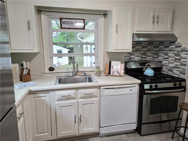 211 Steko Ave, Rochester, NY 14615 - kitchen with appliances with stainless steel finishes, white cabinetry, exhaust hood, light countertops, and tasteful backsplash