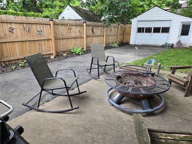 211 Steko Ave, Rochester, NY 14615 - view of patio with a fire pit and an outbuilding