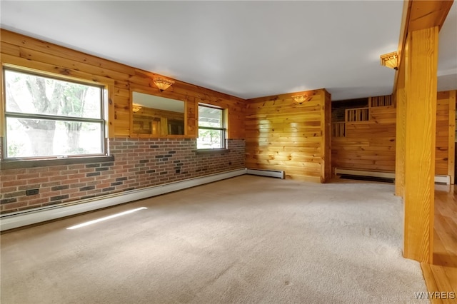 1520 Davis Rd, Aurora, NY 14170 - unfurnished living room with carpet flooring, a baseboard radiator, and wooden walls