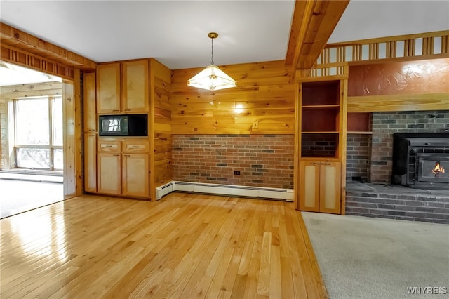 1520 Davis Rd, Aurora, NY 14170 - unfurnished living room featuring a baseboard radiator, light wood finished floors, and a baseboard heating unit