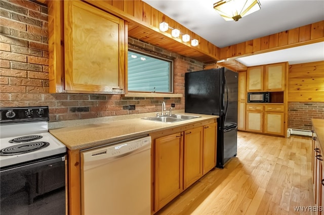 1520 Davis Rd, Aurora, NY 14170 - kitchen with black appliances, brick wall, light wood finished floors, and a baseboard heating unit