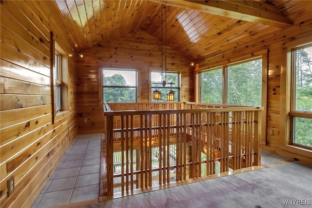 1520 Davis Rd, Aurora, NY 14170 - hallway with lofted ceiling, healthy amount of natural light, wooden walls, and wood ceiling