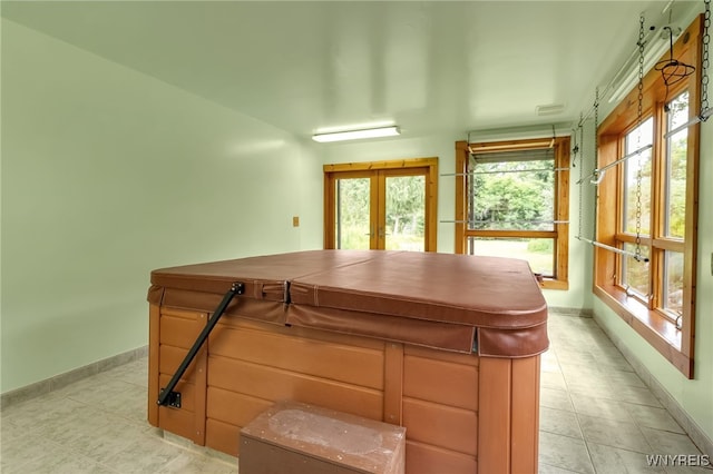1520 Davis Rd, Aurora, NY 14170 - playroom with light tile patterned floors and french doors