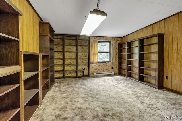 1520 Davis Rd, Aurora, NY 14170 - carpeted empty room featuring a baseboard radiator and wooden walls
