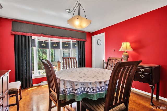 32 Bernhardt Dr Unit 5, Amherst, NY 14226 - dining area featuring wood finished floors
