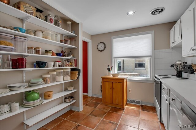 32 Bernhardt Dr Unit 5, Amherst, NY 14226 - kitchen featuring white range with electric cooktop, open shelves, stainless steel dishwasher, white cabinetry, and light countertops
