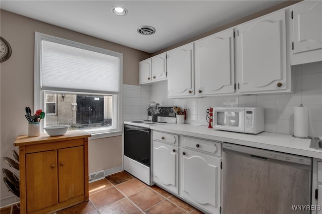 32 Bernhardt Dr Unit 5, Amherst, NY 14226 - kitchen featuring white appliances, backsplash, white cabinets, and recessed lighting