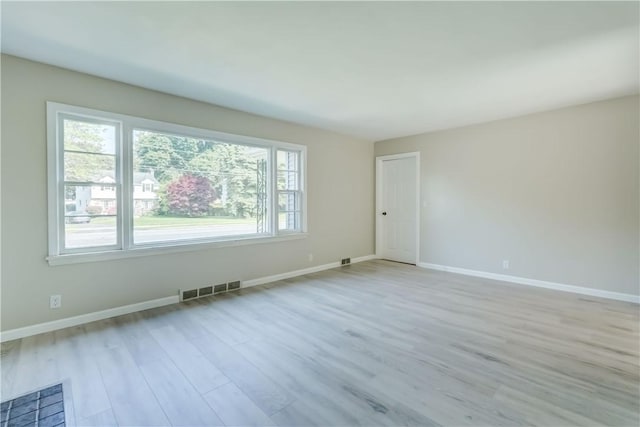 3245 Culver Rd, Irondequoit, NY 14622 - spare room with wood finished floors and baseboards