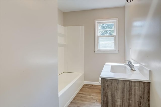 3245 Culver Rd, Irondequoit, NY 14622 - full bathroom with vanity, wood finished floors, and washtub / shower combination