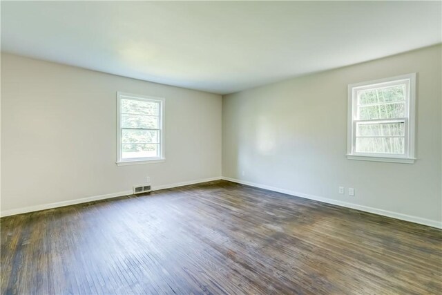 3245 Culver Rd, Irondequoit, NY 14622 - unfurnished room featuring dark wood-style floors and baseboards