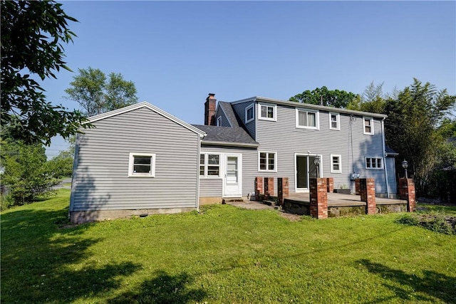 3245 Culver Rd, Irondequoit, NY 14622 - rear view of property with a chimney and a yard