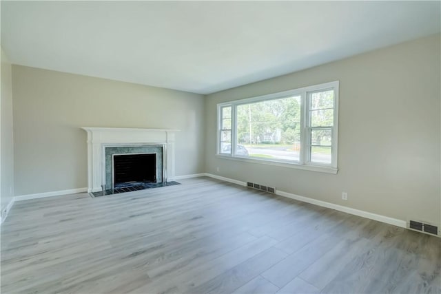3245 Culver Rd, Irondequoit, NY 14622 - unfurnished living room featuring wood finished floors and a high end fireplace