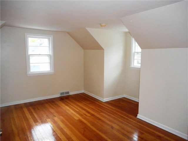 3245 Culver Rd, Irondequoit, NY 14622 - additional living space featuring hardwood / wood-style floors and vaulted ceiling