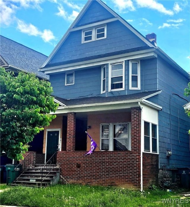 209 W Ferry St Unit S, Buffalo, NY 14213 - american foursquare style home featuring a chimney, a porch, and brick siding