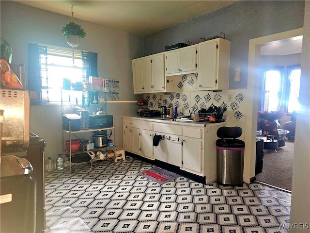 209 W Ferry St Unit S, Buffalo, NY 14213 - kitchen featuring white cabinets and light countertops
