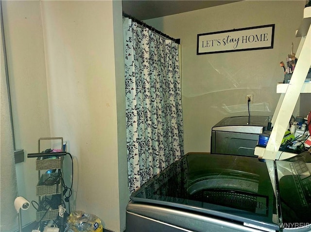 209 W Ferry St Unit S, Buffalo, NY 14213 - bathroom featuring washer / dryer and a shower with shower curtain