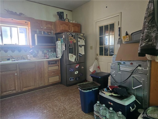 209 W Ferry St Unit S, Buffalo, NY 14213 - kitchen with appliances with stainless steel finishes and brown cabinets