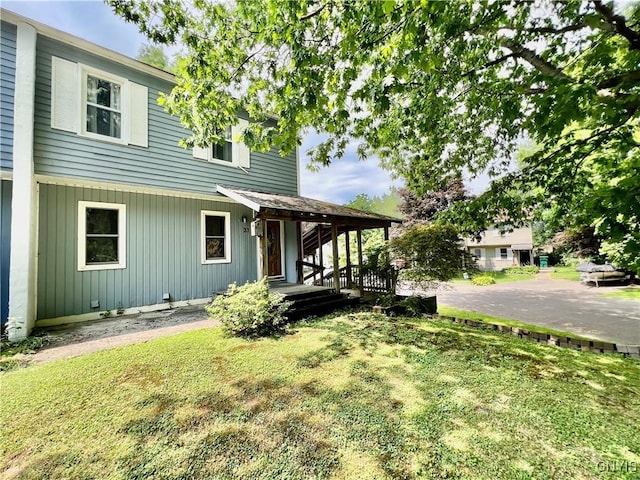 23 Burden Dr, Oswego, NY 13126 - view of front facade with a front yard