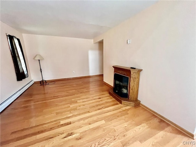 23 Burden Dr, Oswego, NY 13126 - unfurnished living room with light wood finished floors and a glass covered fireplace
