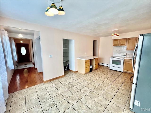 23 Burden Dr, Oswego, NY 13126 - kitchen featuring white electric stove, freestanding refrigerator, light tile patterned flooring, light countertops, and a baseboard heating unit