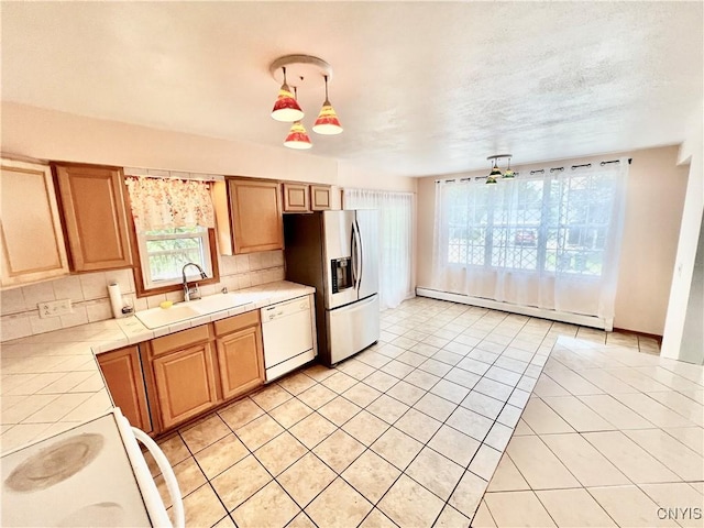 23 Burden Dr, Oswego, NY 13126 - kitchen featuring white dishwasher, tile counters, a baseboard heating unit, stainless steel fridge, and range