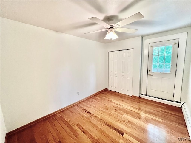 23 Burden Dr, Oswego, NY 13126 - unfurnished bedroom with light wood finished floors, a closet, and ceiling fan