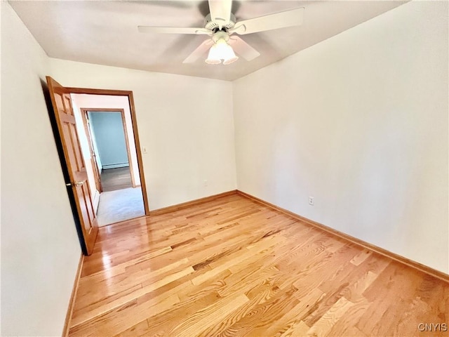 23 Burden Dr, Oswego, NY 13126 - unfurnished room with a baseboard heating unit, light wood finished floors, and ceiling fan