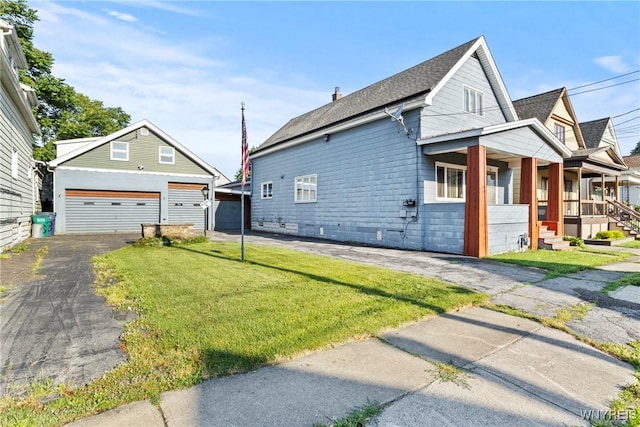 84 Pulaski St, Buffalo, NY 14206 - view of home's exterior featuring a porch, a lawn, a garage, an outdoor structure, and roof with shingles
