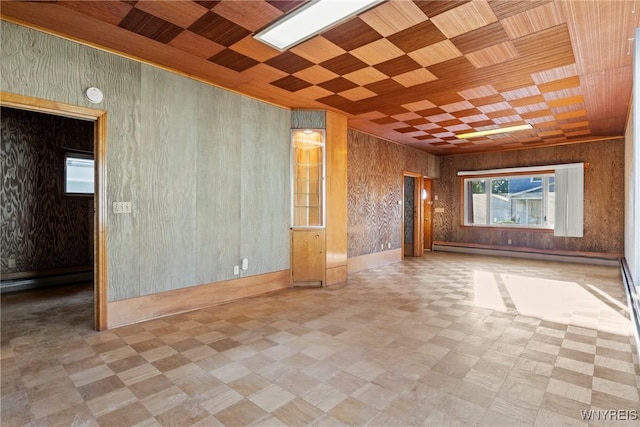 84 Pulaski St, Buffalo, NY 14206 - spare room with a baseboard heating unit, tile patterned floors, wood ceiling, and a smoke detector