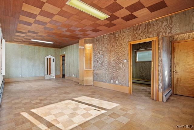 84 Pulaski St, Buffalo, NY 14206 - unfurnished room featuring baseboard heating, a baseboard heating unit, tile patterned floors, and wood ceiling