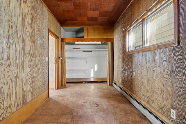 84 Pulaski St, Buffalo, NY 14206 - hall featuring a baseboard heating unit, wooden ceiling, and tile patterned floors