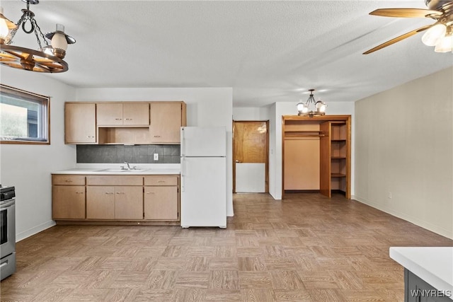 84 Pulaski St, Buffalo, NY 14206 - kitchen with freestanding refrigerator, a chandelier, light countertops, electric range, and a ceiling fan