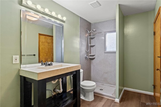 84 Pulaski St, Buffalo, NY 14206 - full bath featuring a tile shower, wood finished floors, and vanity