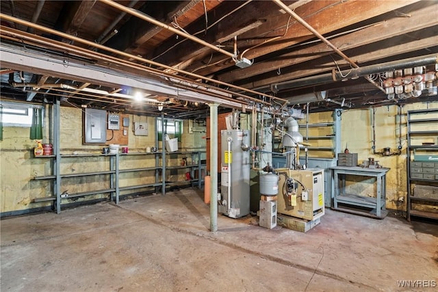 84 Pulaski St, Buffalo, NY 14206 - below grade area with gas water heater, electric panel, a workshop area, and plenty of natural light