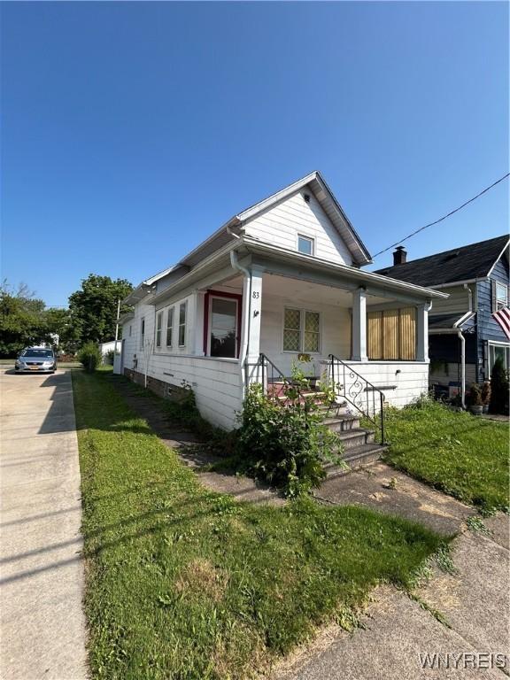 83 Felton St, North Tonawanda, NY 14120 - view of front of home featuring covered porch and driveway