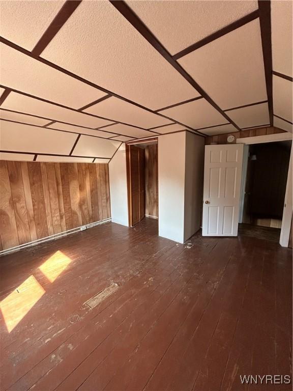 83 Felton St, North Tonawanda, NY 14120 - unfurnished room featuring wood walls and hardwood / wood-style floors