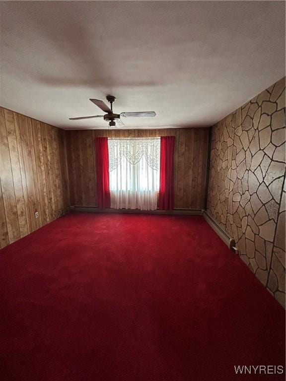 83 Felton St, North Tonawanda, NY 14120 - unfurnished room featuring carpet, a ceiling fan, and wooden walls