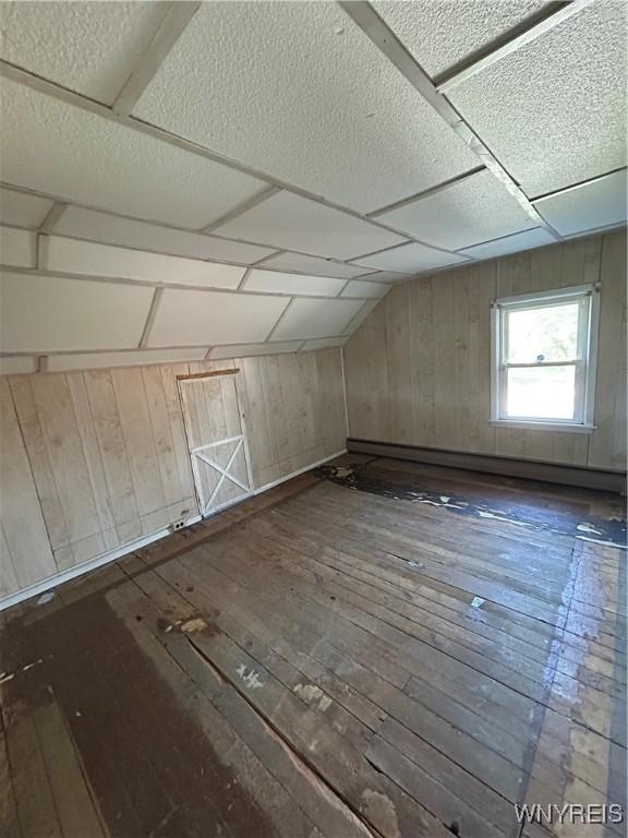 83 Felton St, North Tonawanda, NY 14120 - bonus room featuring hardwood / wood-style floors and wood walls