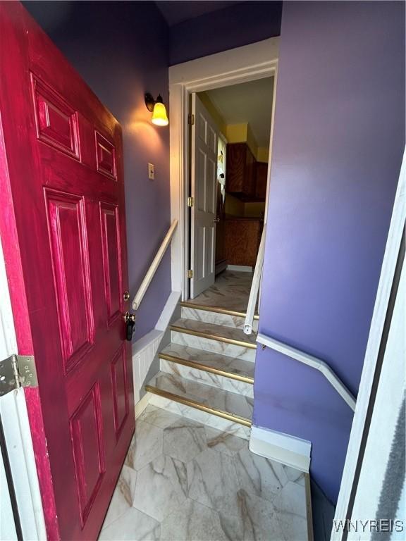 83 Felton St, North Tonawanda, NY 14120 - staircase with marble look tiles