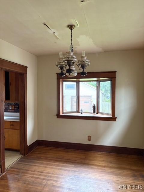 93 Mariemont Ave, Buffalo, NY 14220 - unfurnished dining area featuring a chandelier and light wood-type flooring