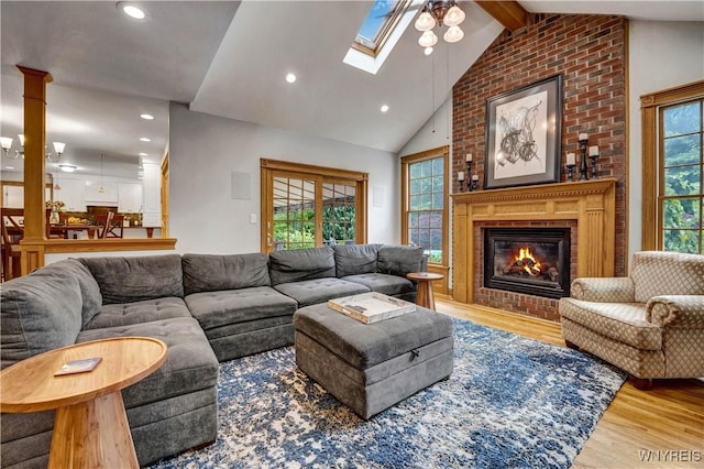 57 Middlebury Rd, Orchard Park, NY 14127 - living room with wood finished floors, recessed lighting, a brick fireplace, a ceiling fan, and a skylight