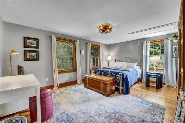 57 Middlebury Rd, Orchard Park, NY 14127 - bedroom featuring attic access, multiple windows, and wood finished floors