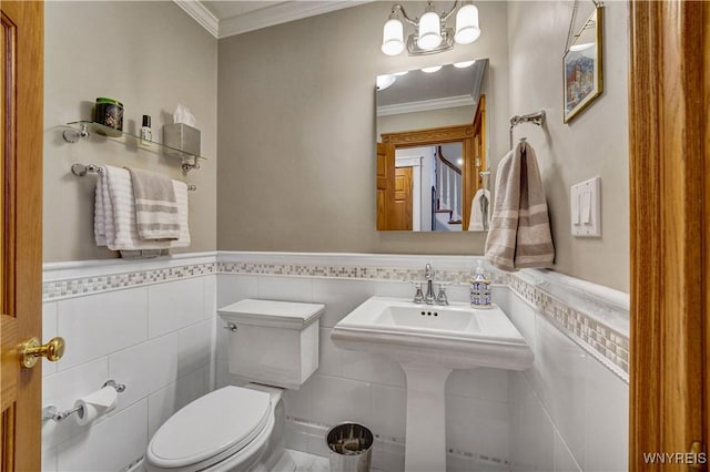 57 Middlebury Rd, Orchard Park, NY 14127 - bathroom with tile walls, ornamental molding, and wainscoting