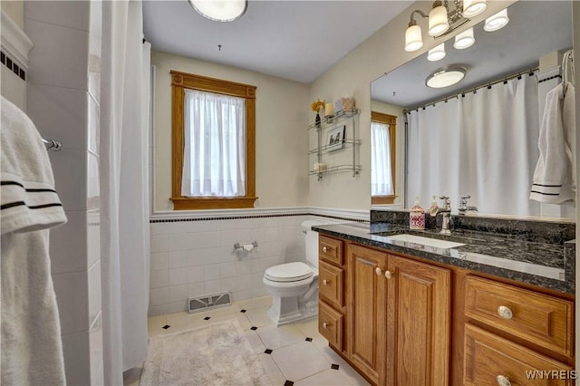 57 Middlebury Rd, Orchard Park, NY 14127 - full bath with tile patterned floors, tile walls, vanity, wainscoting, and a shower with curtain