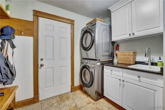 57 Middlebury Rd, Orchard Park, NY 14127 - washroom featuring stacked washer / drying machine and cabinet space