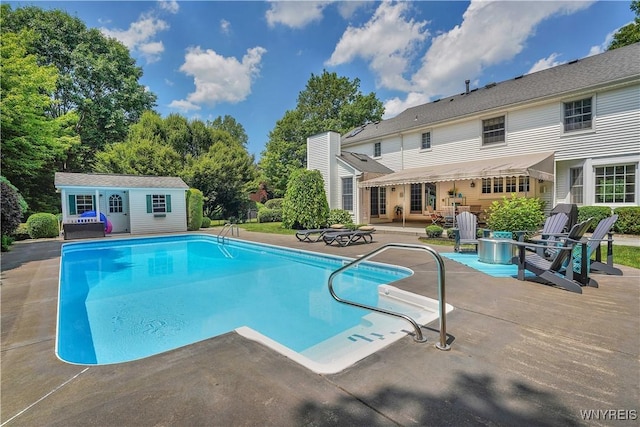 57 Middlebury Rd, Orchard Park, NY 14127 - outdoor pool with a patio area, an exterior structure, and an outdoor structure