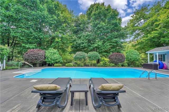 57 Middlebury Rd, Orchard Park, NY 14127 - swimming pool with a patio and view of wooded area